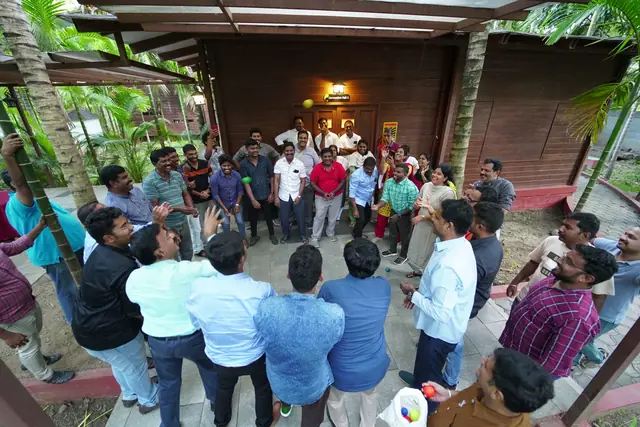 Participants in a circle outdoors
