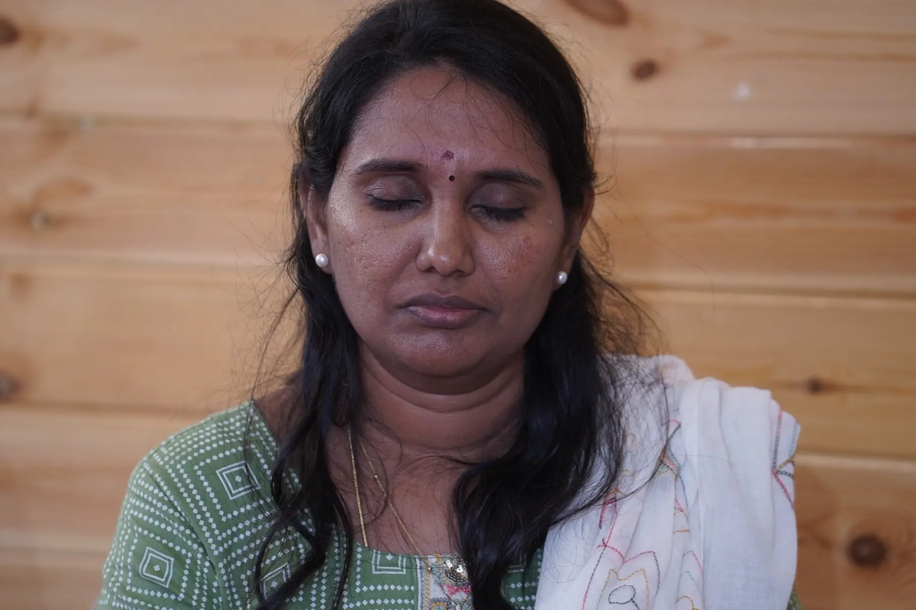 A participant with her eyes closed, visualizing