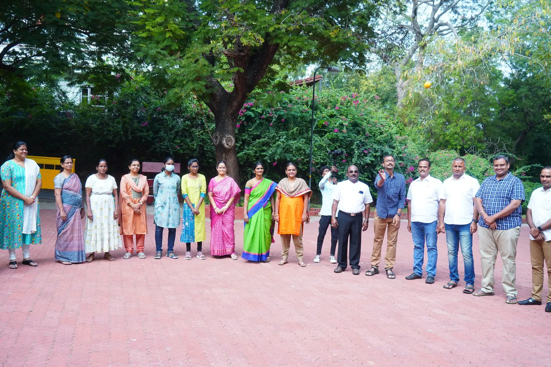 Participants standing together in a garden