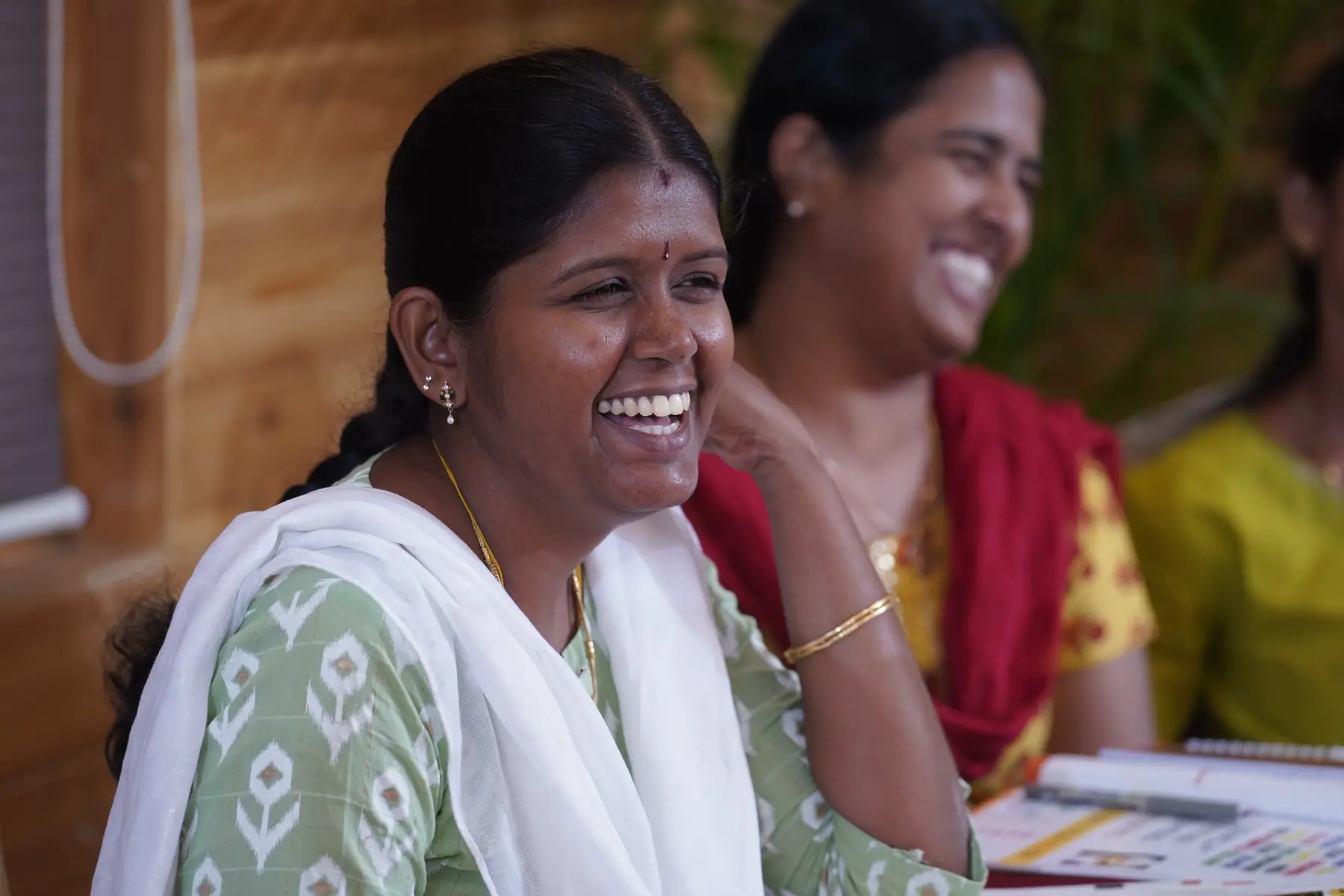 Two participants laughing together
