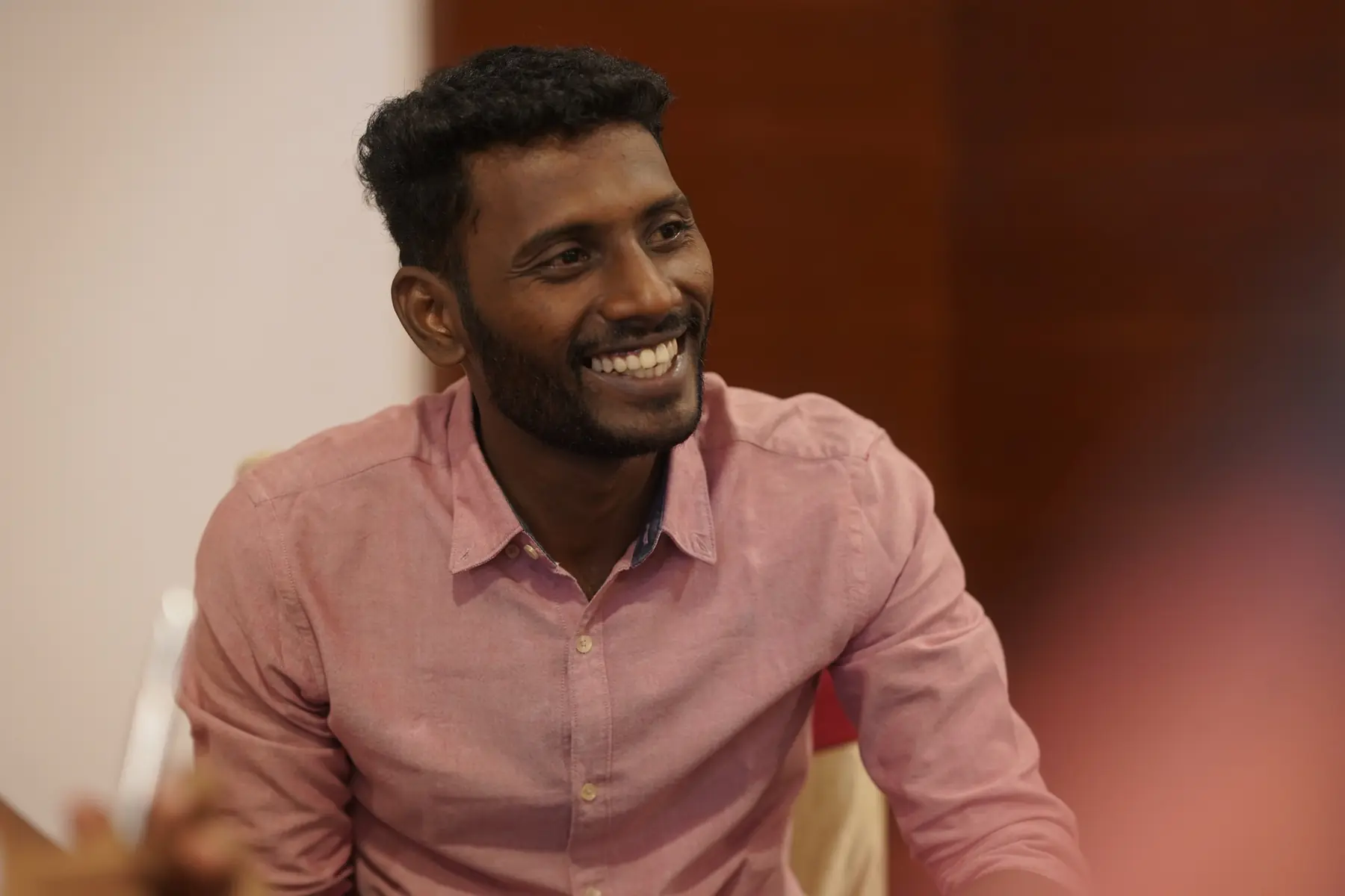 A young participant smiling