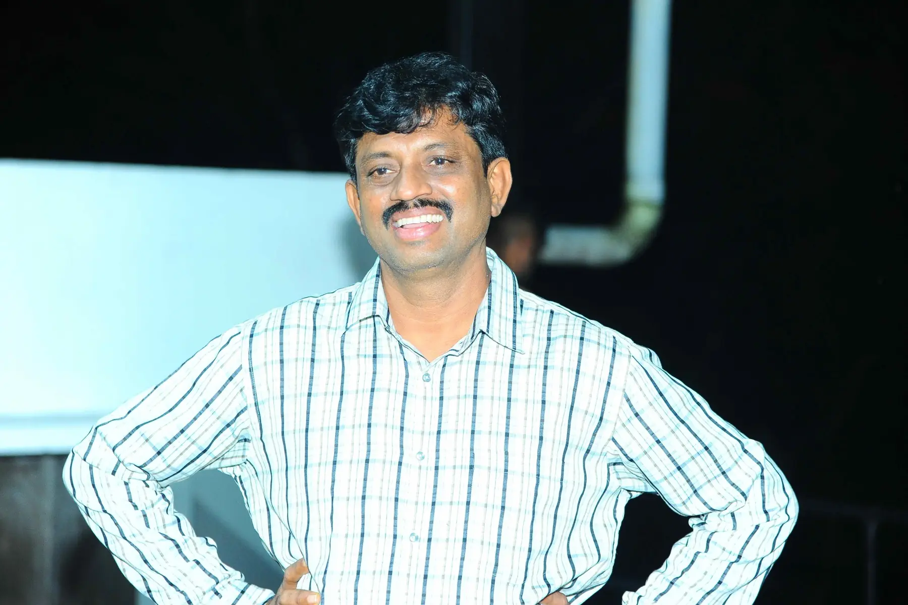 A participant standing with a broad smile