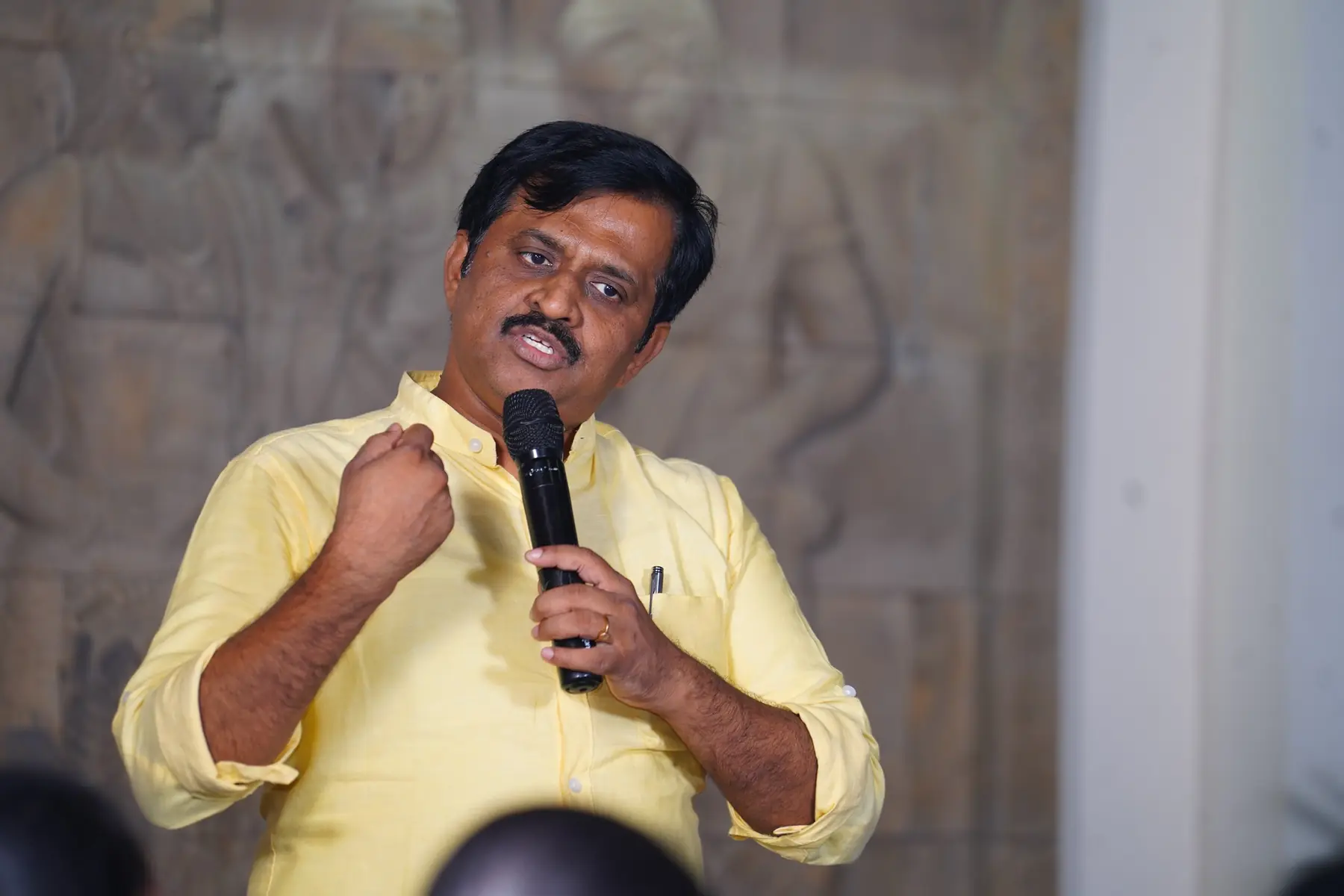 Surekaa Sundar speaking with a microphone